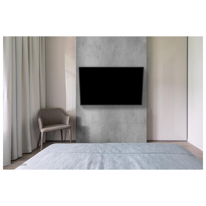Neomounts WL40-550BL18 Supporto TV a parete Full Motion per schermi 43-75'' con regolazione inclinazione e rotazione fino a 54° e gestione cavi integrata colore Nero